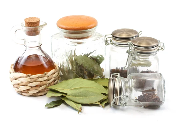 Vinegar bottle, spices and laurel leaf on the white — Stock Photo, Image