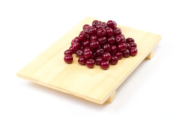 Plate with ripe cherries. Isolated on a white background. — Stock Photo, Image
