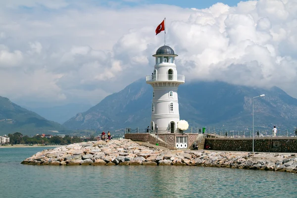 Lighthouse in port. Turkey, Alanya. Sunny weather — Stock Photo, Image