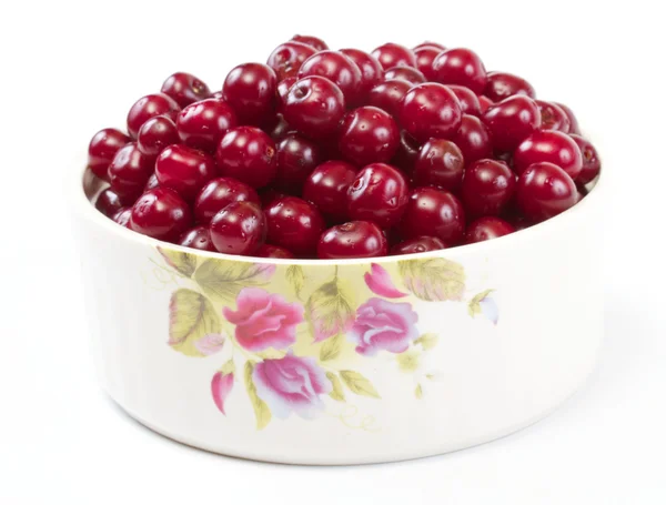 stock image Bowl with ripe cherries. Isolated on a white background.