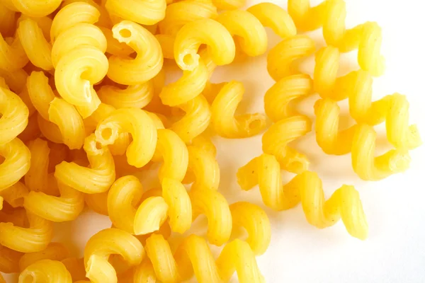Tørret italiensk pasta på hvid baggrund - Stock-foto