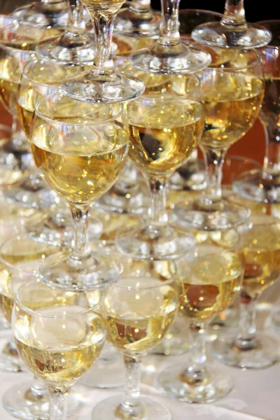 stock image Closeup of white wine glasses in a line