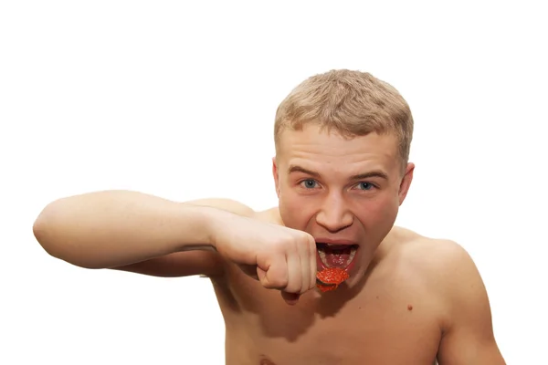 Mladý muž jí červený kaviár — Stock fotografie