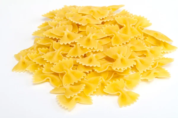 Közelkép a szárított olasz tészta, a fehér háttér — Stock Fotó