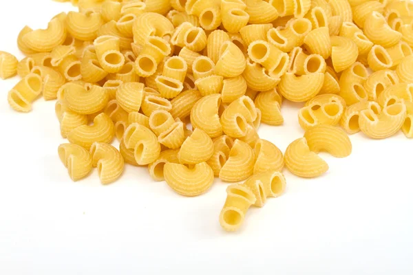 Close up de uma massa italiana seca no fundo branco — Fotografia de Stock