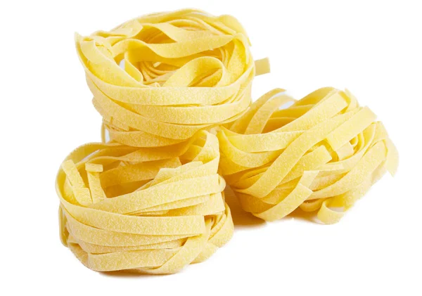 Heap of raw dry nest pasta over white background — Stock Photo, Image