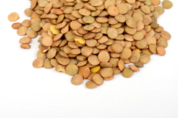 Pile of green lentils from low perspective isolated on white. — Stock Photo, Image
