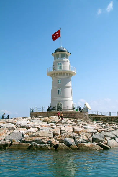Lighthouse in port. Turkey, Alanya. Sunny weather — Stock Photo, Image
