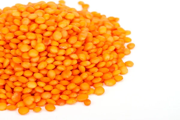 Heap of raw red lentils isolated on white background — Stock Photo, Image