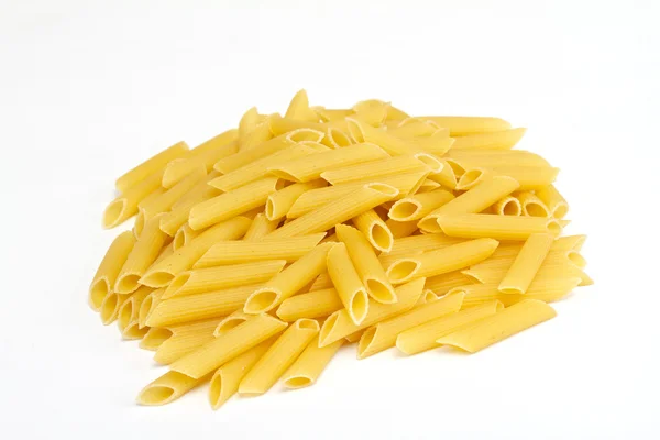 Közelkép a szárított olasz tészta, a fehér háttér — Stock Fotó
