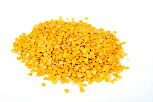 Yellow lentils isolated on white background.Macro shot. — Stock Photo, Image