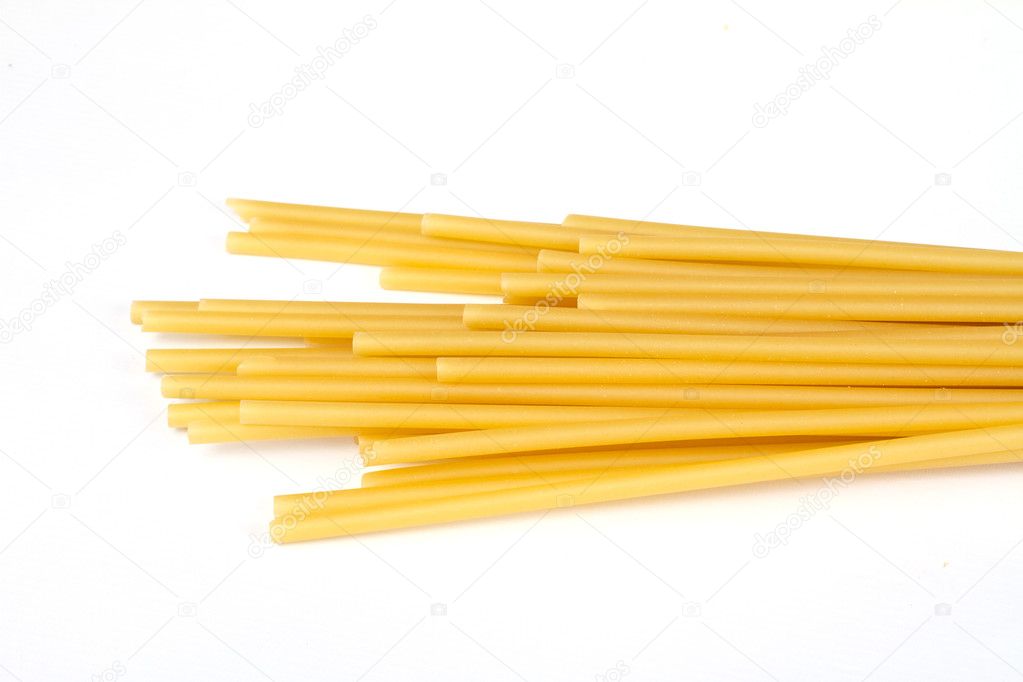 Uncooked spaghetti noodles isolated on white background