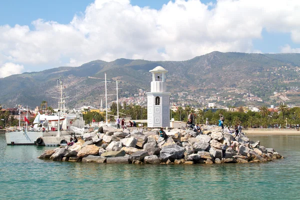 stock image Lighthouse in port. Turkey, Alanya. Sunny weather