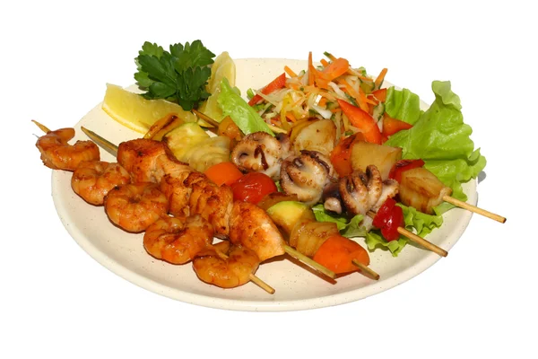 Seafood barbecue with salad and lemon