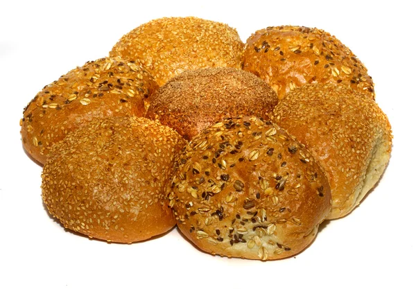 stock image Loaf of bread and rolls isolated on white