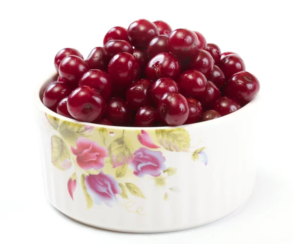 Stock image Bowl with ripe cherries. Isolated on a white background.