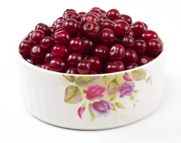 stock image Bowl with ripe cherries. Isolated on a white background.