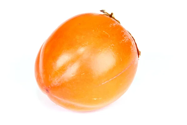 stock image A single persimmon laying on a white background