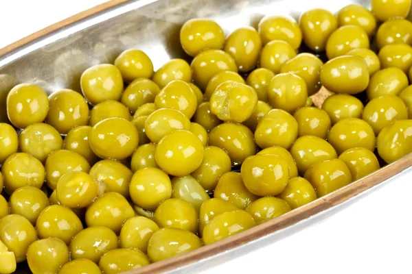 Green peas on a white background — Stock Photo, Image