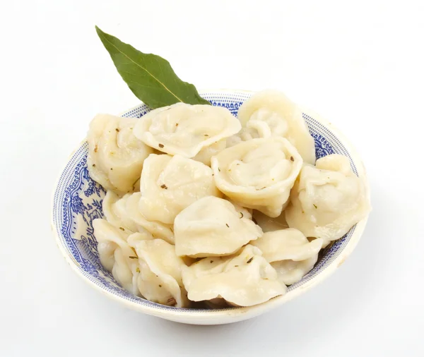 stock image Meat Dumplings - russian pelmeni - with laurel