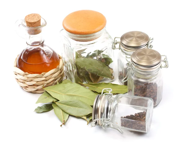 stock image Vinegar bottle, spices and laurel leaf on the white