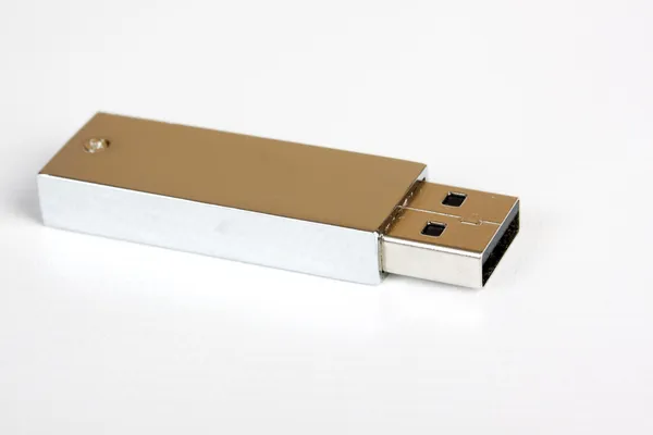 Unidade flash USB prata no branco — Fotografia de Stock