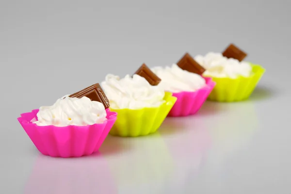 Four portions of whipped cream — Stock Photo, Image