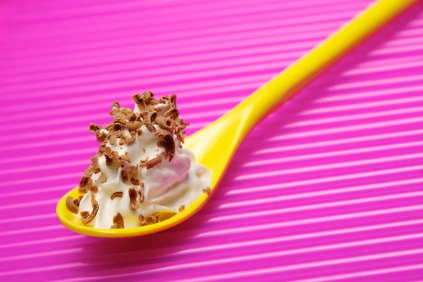 Spoon full of whipped cream with chocolate shavings — Stock Photo, Image