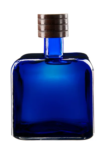 Square blue glass bottle full of tequila. — Stock Photo, Image