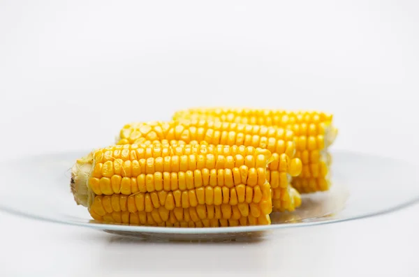 Kukorica csövek a üveglappal. kis dof — Stock Fotó