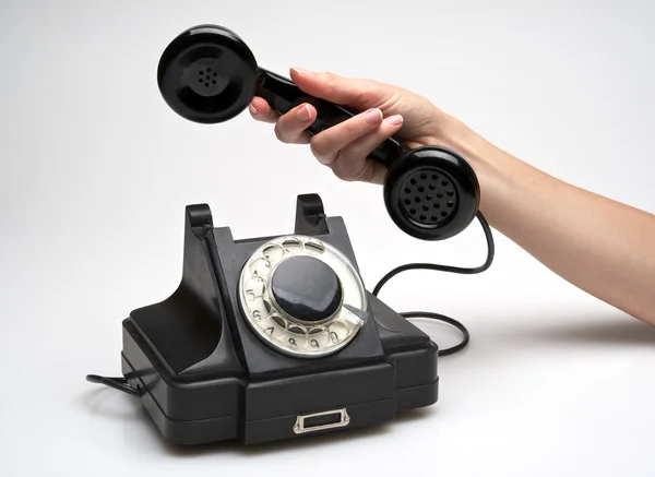 Vintage telephone being picked up — Stock Photo, Image