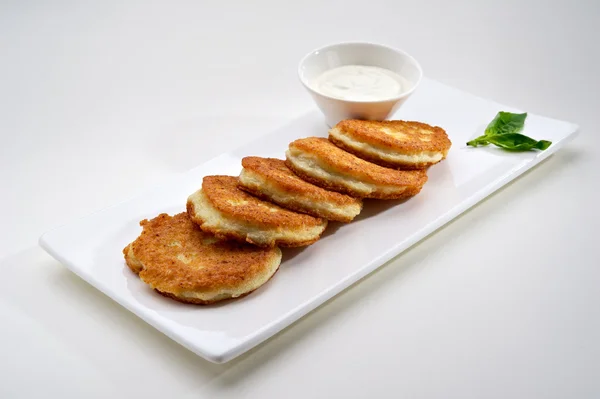 stock image Potato pancakes with sour cream