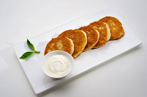 stock image Potato pancakes with sour cream