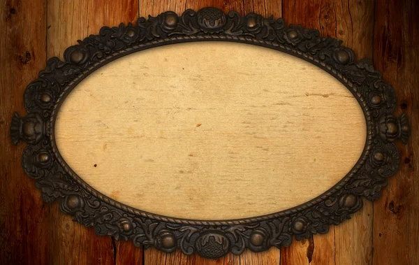 Antique frame with blank paper on knotty wood wall — Stock Photo, Image