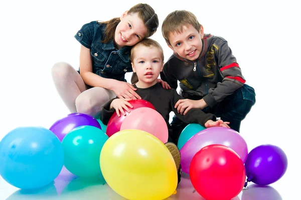 Crianças com os balões — Fotografia de Stock