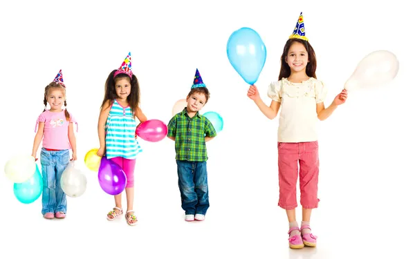 Діти в шапках на день народження — стокове фото