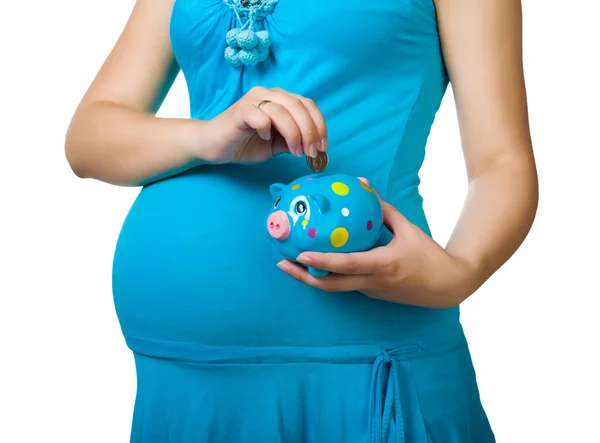 Zwangere vrouw bedrijf piggy bank — Stockfoto