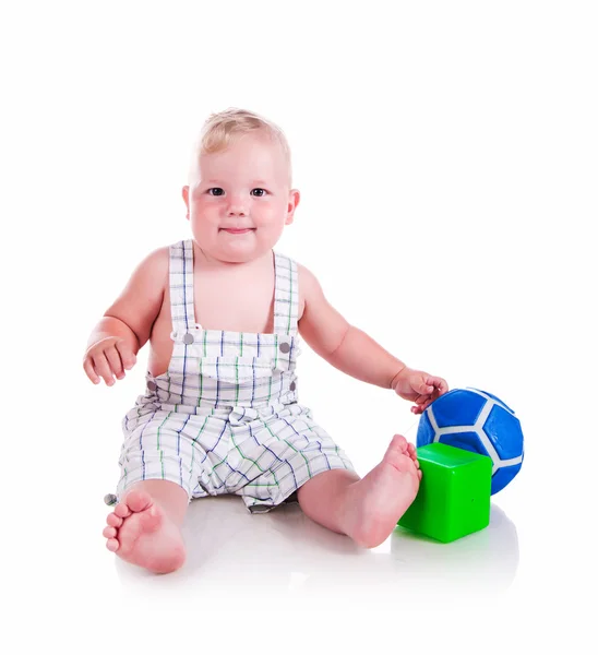 Маленький хлопчик з іграшками — стокове фото