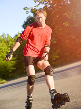 Young active roller blade skater clipart