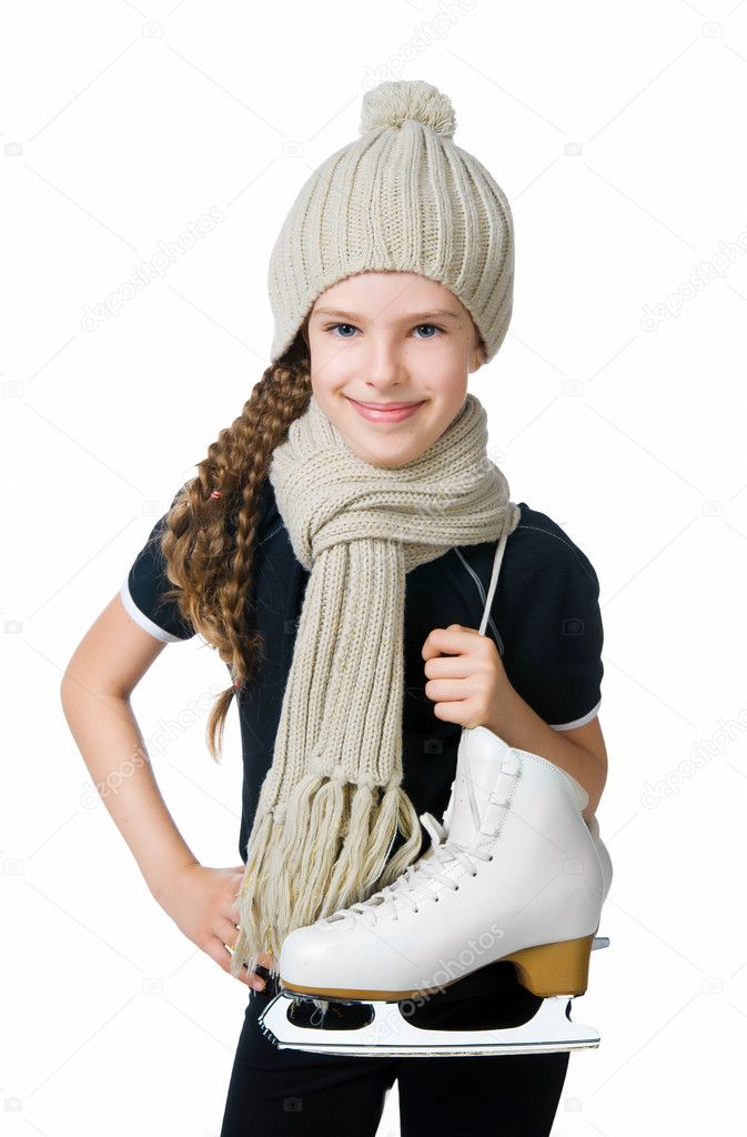 Cute little girl with figure skates