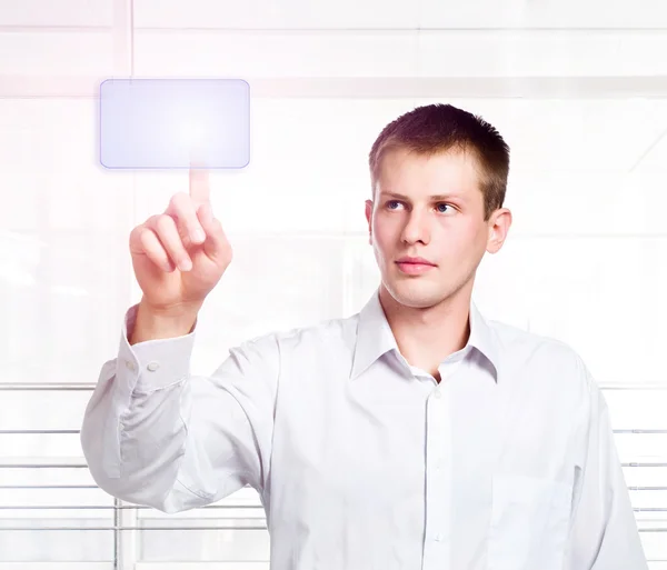 Businessman pressing a touchscreen button — Stock Photo, Image