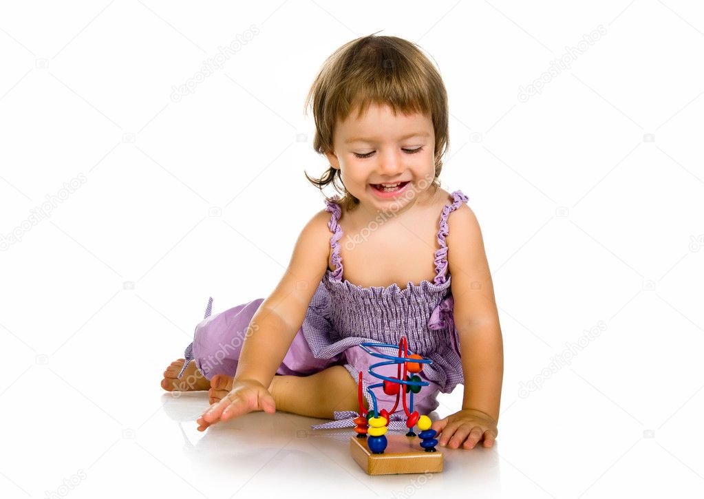 Small baby with developmental toy