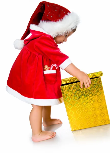 Menina em Papai Noel com presentes — Fotografia de Stock