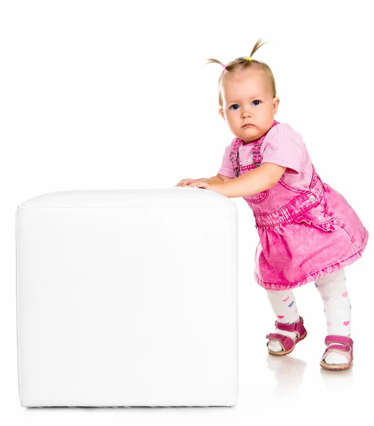 Little girl on the block with letter — Stock Photo, Image
