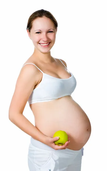 Όμορφη έγκυο γυναίκα, κρατώντας ένα μήλο — Φωτογραφία Αρχείου