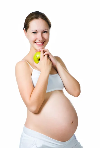 Красива вагітна жінка тримає яблуко — стокове фото