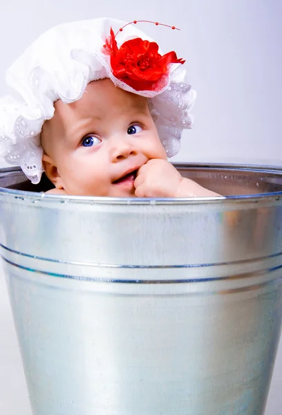 Baby on a bucket — Stock Photo, Image