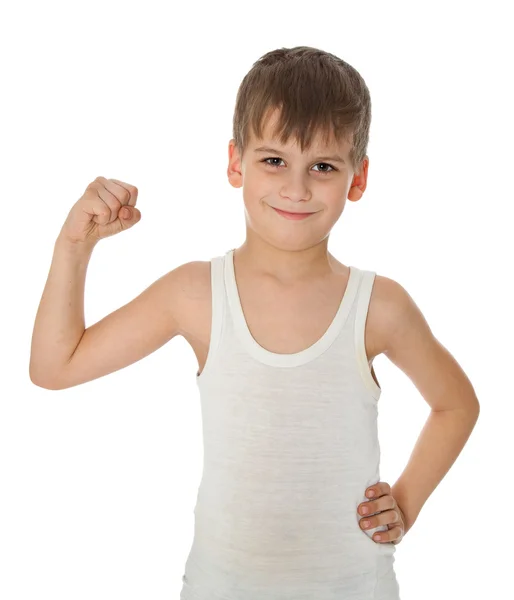 Junge zeigt seine Muskeln — Stockfoto