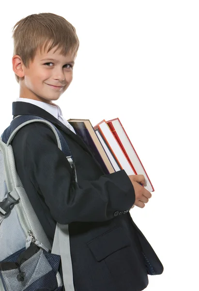 Niño sosteniendo libros — Foto de Stock