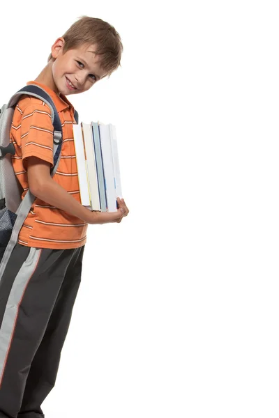 Pojke anläggning böcker — Stockfoto